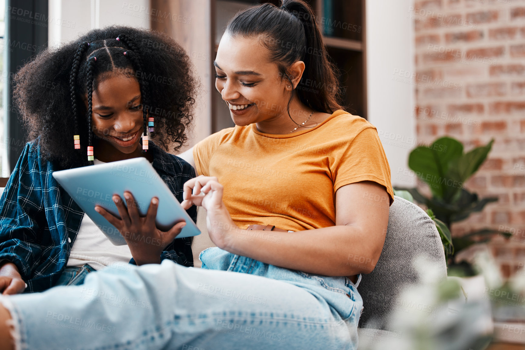 Buy stock photo Smile, woman and child with tablet at house for acceptance  at private school, scholarship and education. Happy, mother and girl on sofa with positive news, email and online learning for knowledge