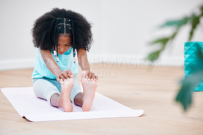 Buy stock photo Shot of a young girl practicing yoga at home