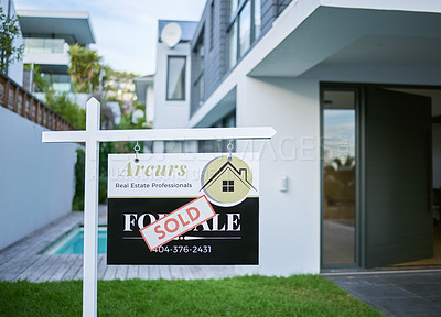 Buy stock photo Shot of a sold sign in a yard of a newly bought house