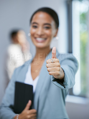Buy stock photo Shot of a young female real estate agent showing a thumbs up