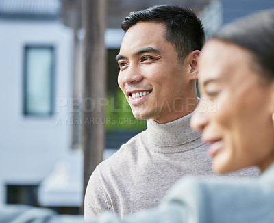 Buy stock photo Shot of a young female real estate agent showing a client a house