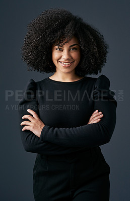 Buy stock photo Shot of a young businesswoman against a studio background