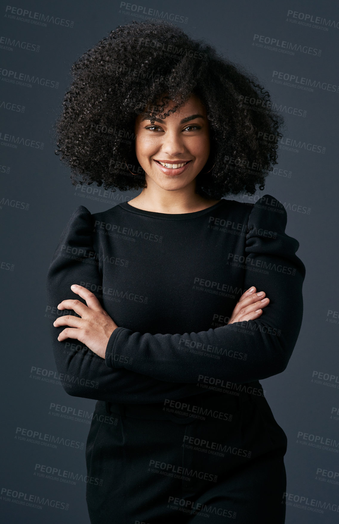 Buy stock photo Shot of a young businesswoman against a studio background