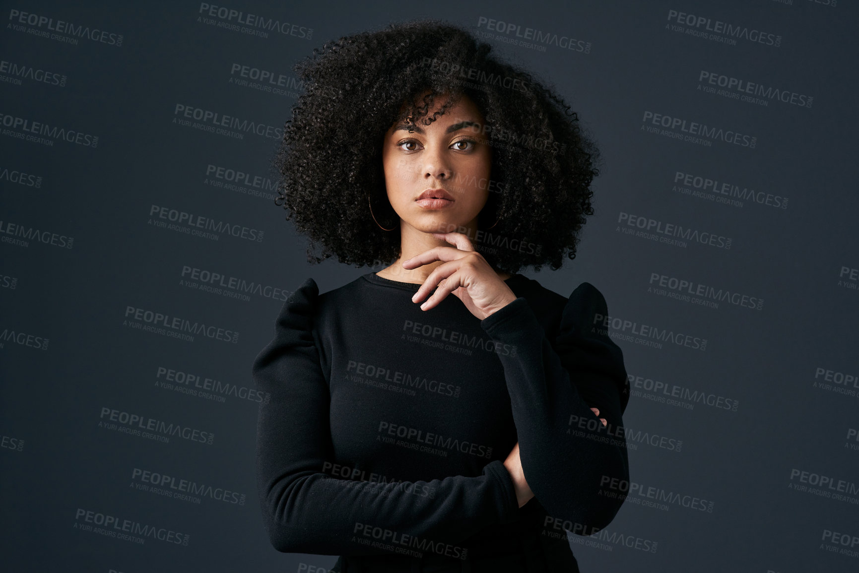 Buy stock photo Shot of a young businesswoman against a studio background