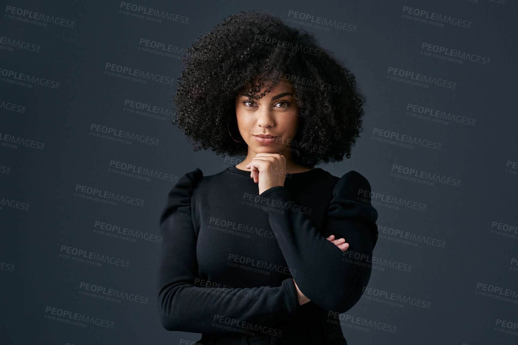 Buy stock photo Shot of a young businesswoman against a studio background