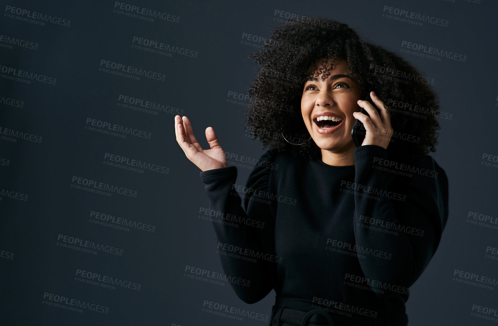 Buy stock photo Shot of a young businesswoman using her smartphone against a studio background