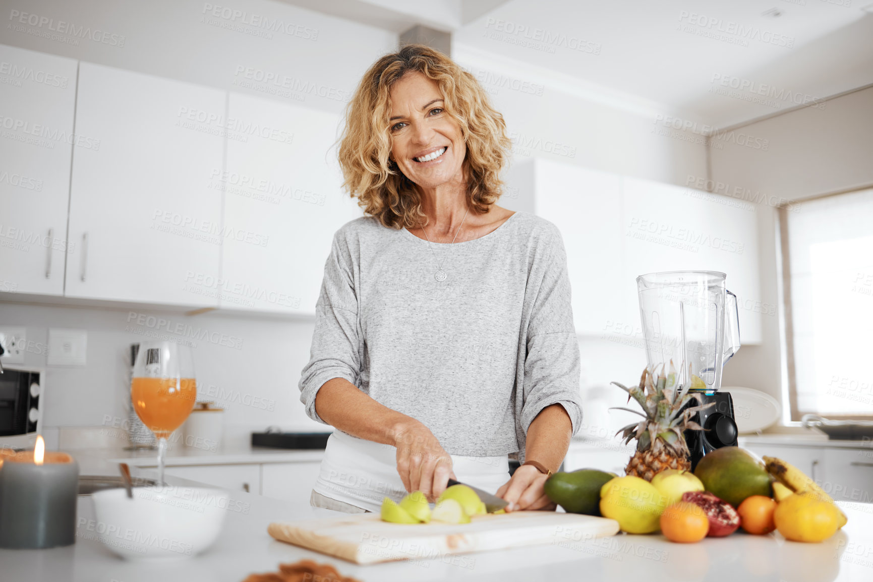 Buy stock photo Woman, knife and fruit in kitchen for portrait with apple, nutrition and meal prep for smoothie in morning. Person, chef and chopping board with ingredients for diet, gut health and home in France