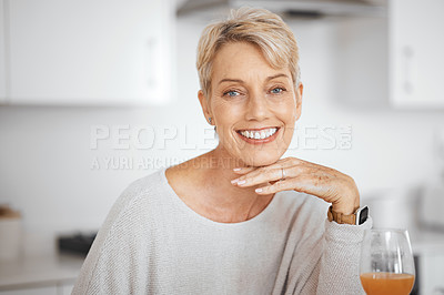 Buy stock photo Shot of a mature woman relaxing in her home