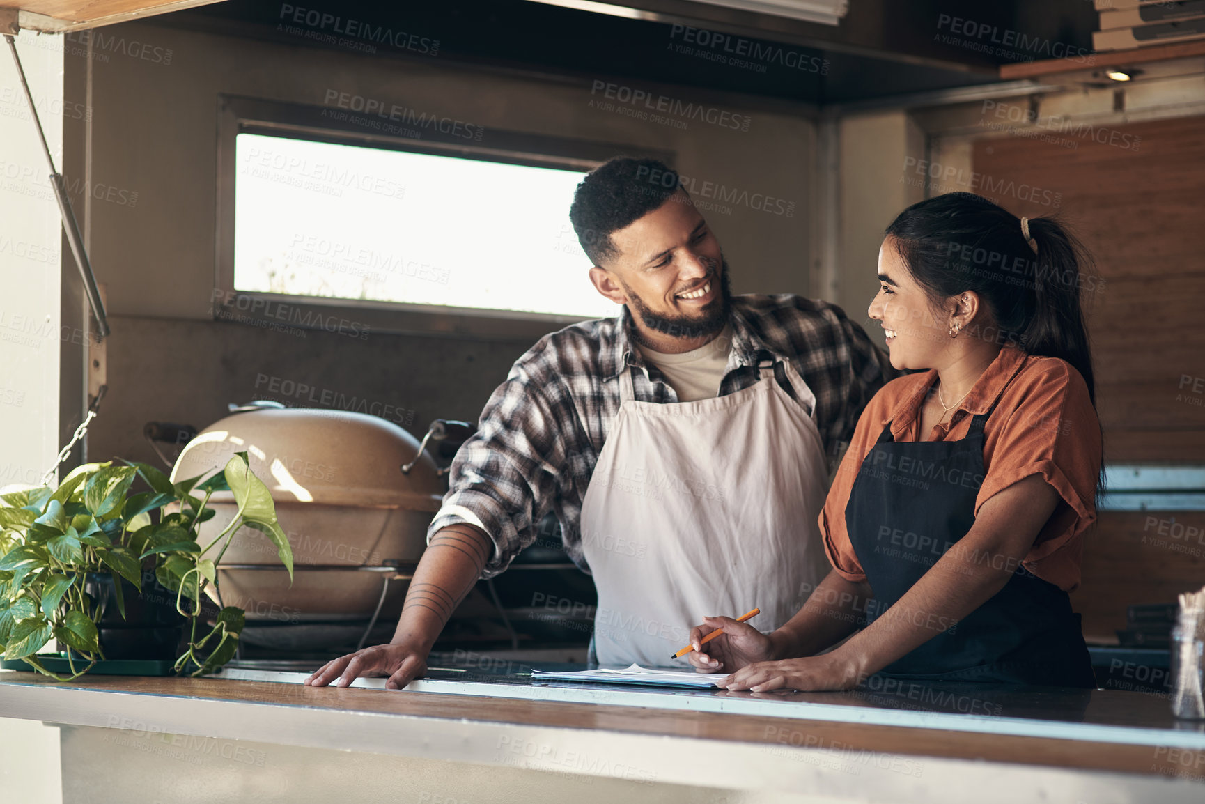 Buy stock photo Writing, team and documents with people in food truck for small business, menu planning and vendor. Entrepreneur, cafe shift roster and hospitality with man and woman at coffee shop for catering