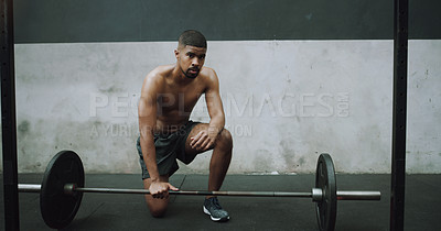 Buy stock photo Portrait of a muscular young man exercising with a barbell in a gym