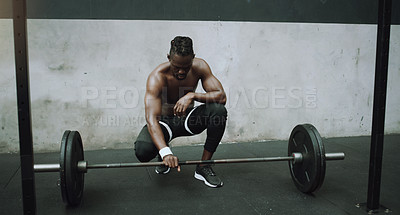 Buy stock photo Weightlifting, bodybuilder and black man with barbell in gym for training, exercise and strong workout. Fitness, muscles and male person lifting weights for challenge, wellness and body strength