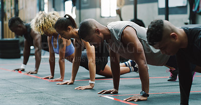 Buy stock photo Teamwork, fitness and people do push up in gym for training, exercise and workout class. Health, sports club and serious group of men and women body builders for challenge, wellness and strength
