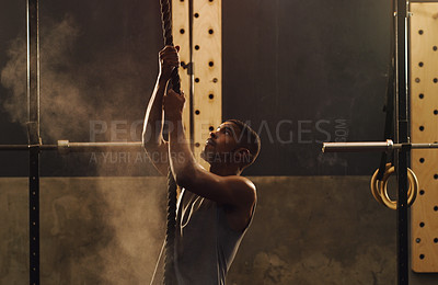 Buy stock photo Man, rope and climbing in gym for fitness challenge, start and training for growth of strong muscle. Person, athlete and vision for exercise, workout and performance for wellness with healthy body