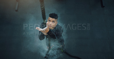 Buy stock photo Rope climbing, fitness and man at gym from above for training, performance and intense cardio on black background. Top view, climb and male with ropes, resilience and mindset during power workout
