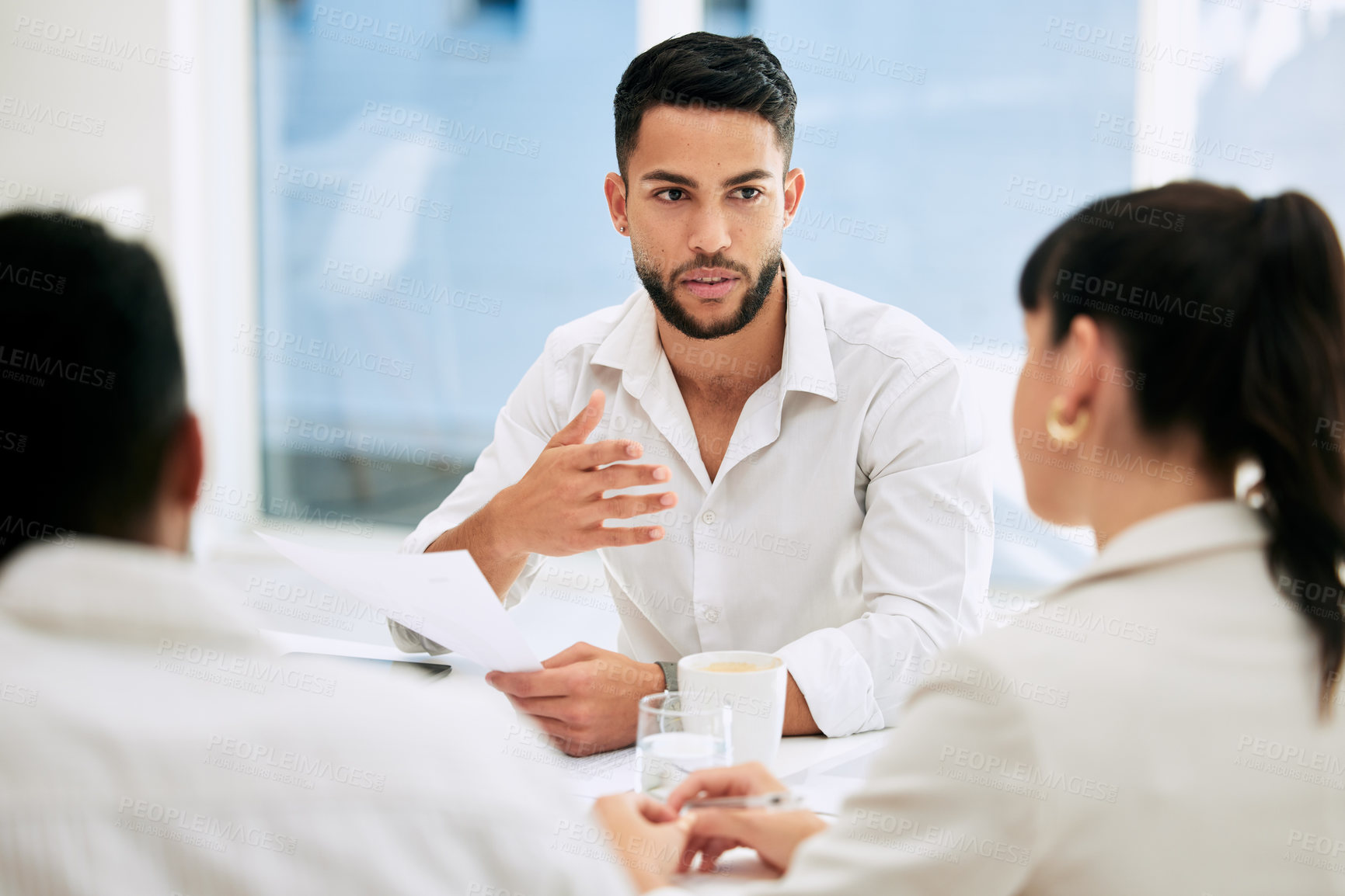 Buy stock photo Shot of businesspeople having a meeting in a boardroom at work