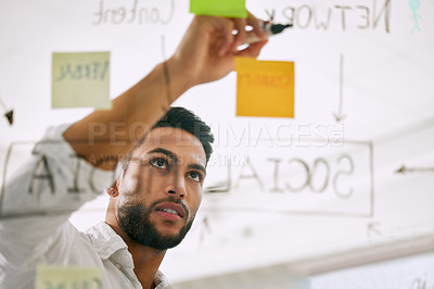Buy stock photo Writing, planning and business man for brainstorming, project workflow and management goals on glass board. Startup, ideas and creative worker, employee or person with work schedule with sticky notes