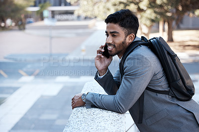Buy stock photo Business man, backpack and phone call in street, city or smile with vision, networking or listen. Young indian businessman, outdoor and walk with smartphone, talk and professional in metro for travel
