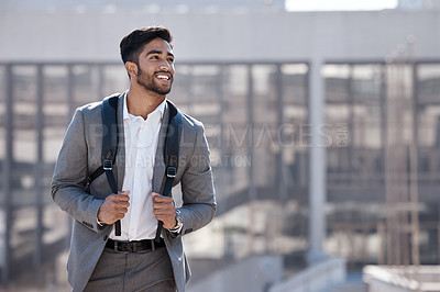 Buy stock photo Travel, happy and businessman walking in the city to his office building in the morning. Confidence, backpack and professional male employee with a smile commuting to work in an urban town street.
