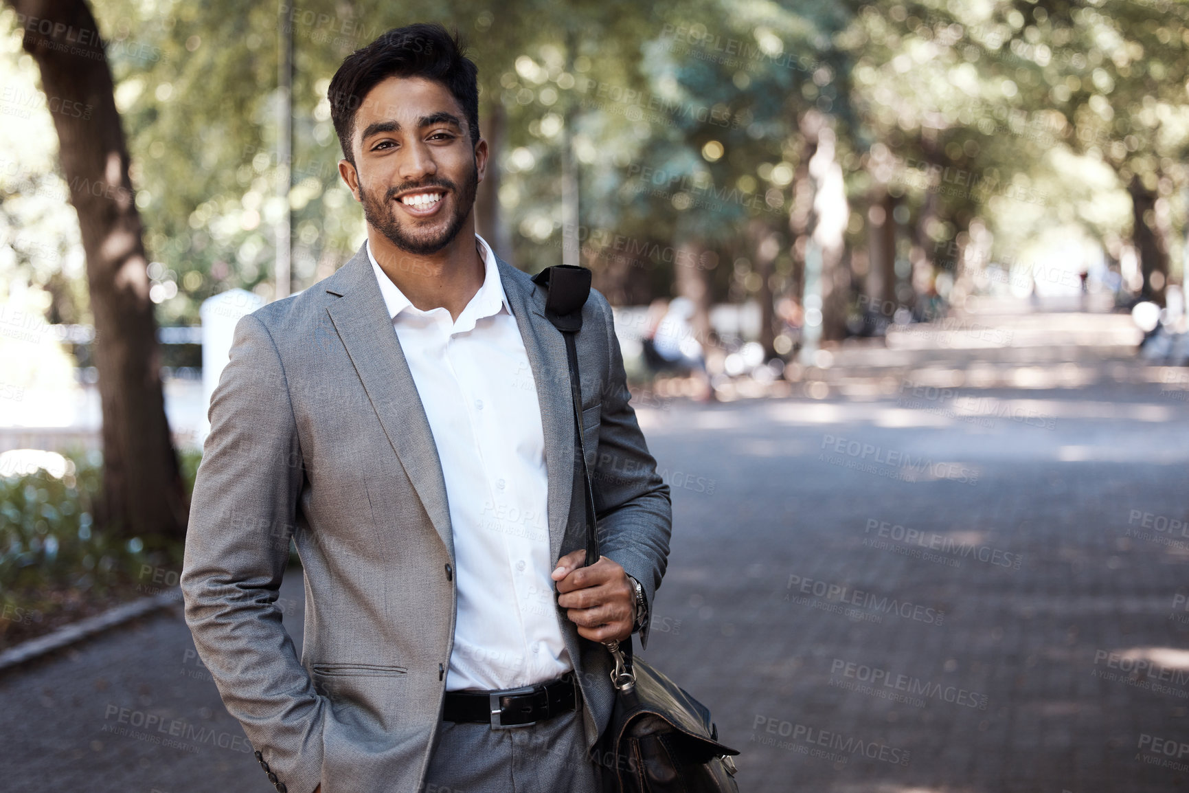 Buy stock photo Portrait, business and happy man in city for travel, morning commute or urban journey outdoor. Corporate male employee, entrepreneur and confident in street with pride, professional commitment or bag