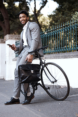 Buy stock photo Bicycle, portrait and business man with phone in a city for texting, social media and cycling break. Bike, commute and male person with smartphone in a street for location, search and GPS navigation