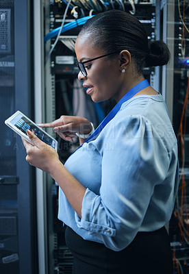 Buy stock photo IT woman, engineer and tablet in a server room for programming, cybersecurity or maintenance. Black female technician in datacenter for network, software or system upgrade app with technology