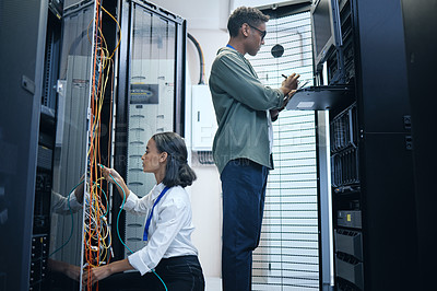 Buy stock photo Server room, engineer and IT team with a tablet for programming, cybersecurity or cable maintenance. Man and woman technician together in datacenter for network, software or system upgrade with tech