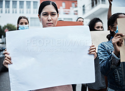 Buy stock photo Shot of a young woman protesting at a covid vaccine march