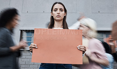 Buy stock photo Shot of a young woman protesting at a covid vaccine march
