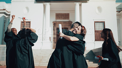 Buy stock photo Shot of students hugging and celebrating on graduation day
