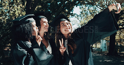 Buy stock photo Shot of a group of female students taking a selfie on graduation day