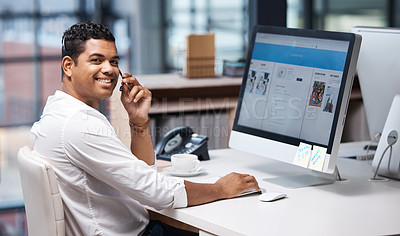 Buy stock photo Portrait of a young businessman working on a computer in a call centre