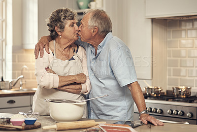 Buy stock photo Shot of a senior couple baking together at home