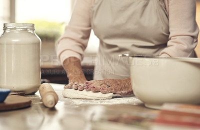 Buy stock photo Shot of an unrecognizable person baking in the kitchen at home
