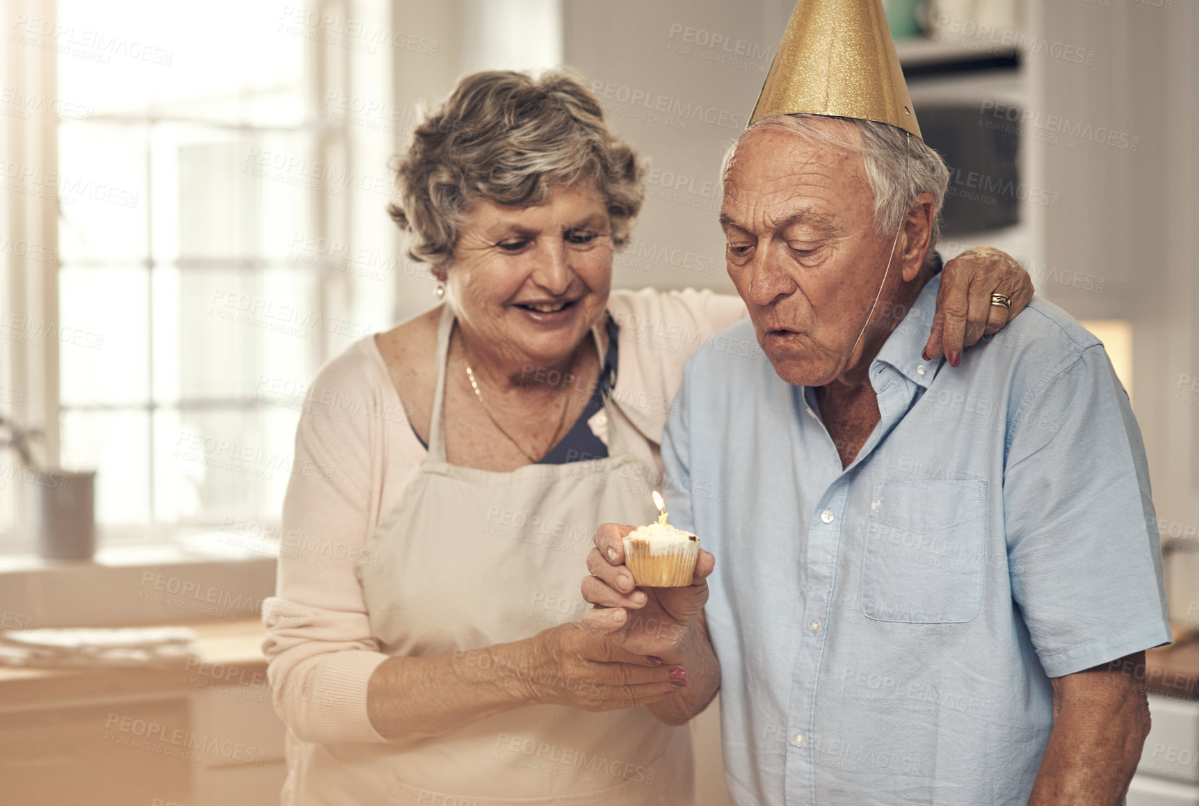 Buy stock photo Shot of a senior couple celebrating a birthday at home