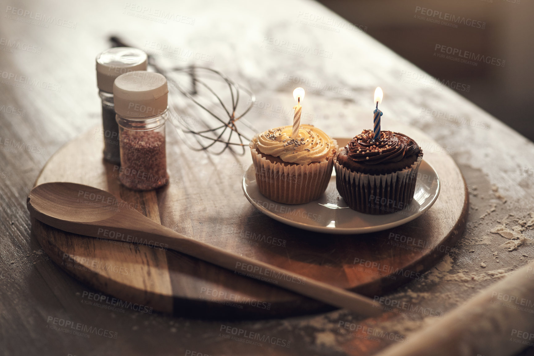 Buy stock photo Shot of cupcakes on a plate in a kitchen