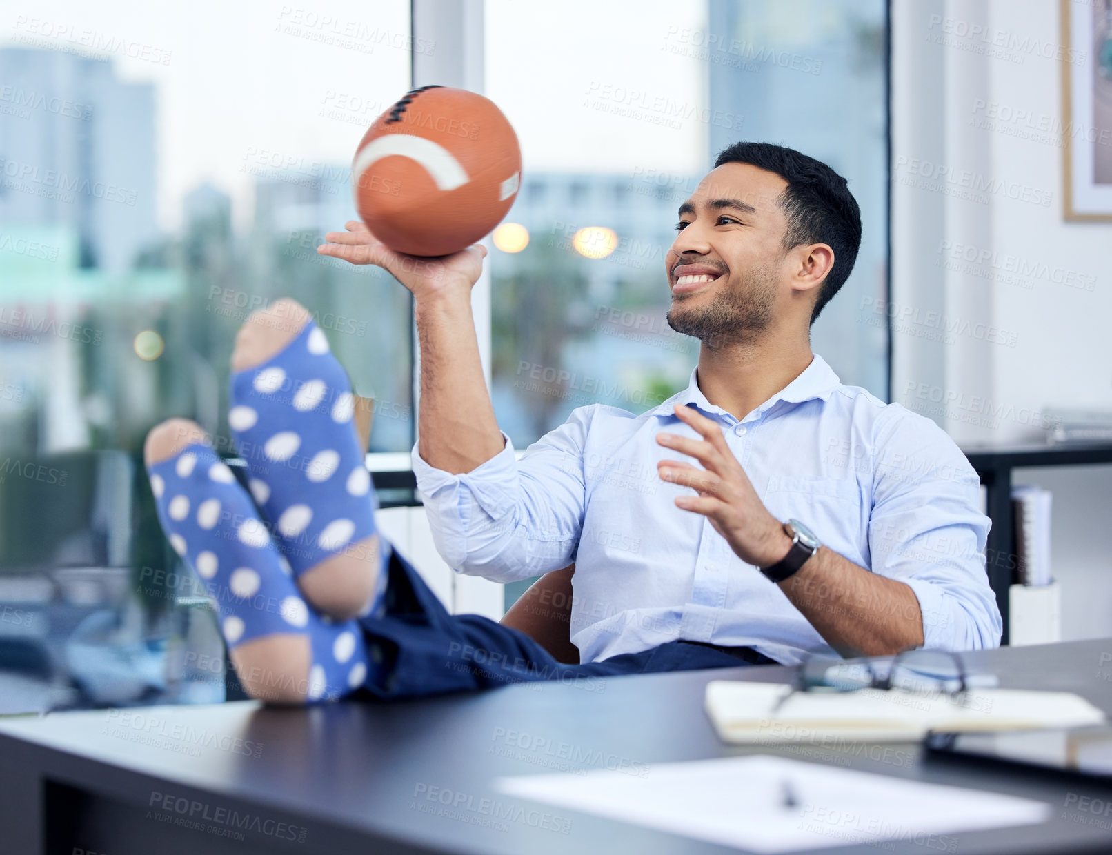 Buy stock photo Happy, businessman and ball to relax and rest after work for freedom and balance. Excited, male sports bettor and break after successful game or bet with budget review on financial margins of risk