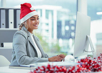 Buy stock photo Shot of a happy businesswoman on a video call at her desk at the office