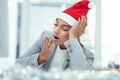 Buy stock photo Shot of a sleepy woman yawning at her desk in the office