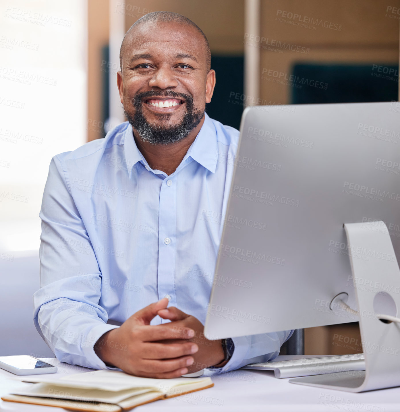 Buy stock photo Computer, business and portrait of black man in office with notebook for planning, online project and proposal. Corporate consultant, desk and happy worker on pc for email, website and research