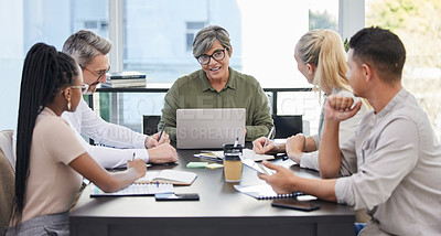 Buy stock photo Shot of a team of business people having a meeting