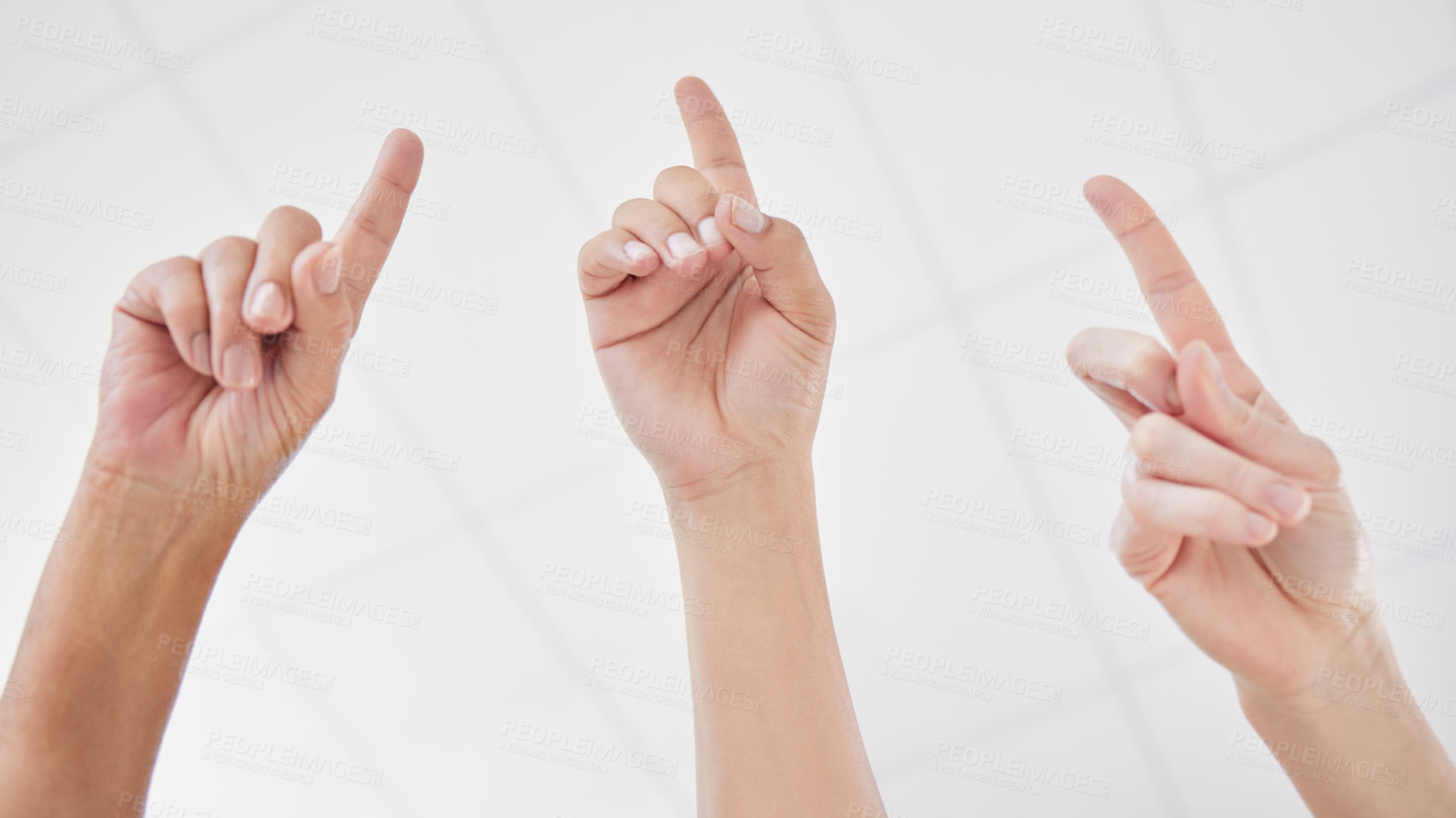 Buy stock photo Shot of a group of coworkers with their hands raised