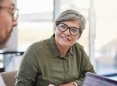 Buy stock photo Shot of a mature businesswoman having a meeting with her colleague