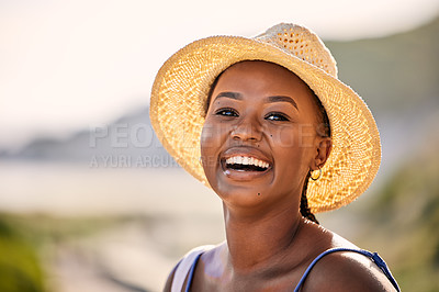 Buy stock photo Black, woman and portrait by ocean with smile for vacation, travel or relax in Thailand. Female tourist and beach or happiness for holiday in tropical climate, sunshine in nature with straw hat