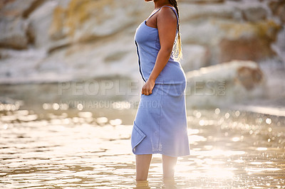 Buy stock photo Summer, fashion and African woman in ocean for sunset, holiday and freedom in nature for peace. Vacation, sea and adventure in Indonesia for trendy clothes, get away and style on tropical island