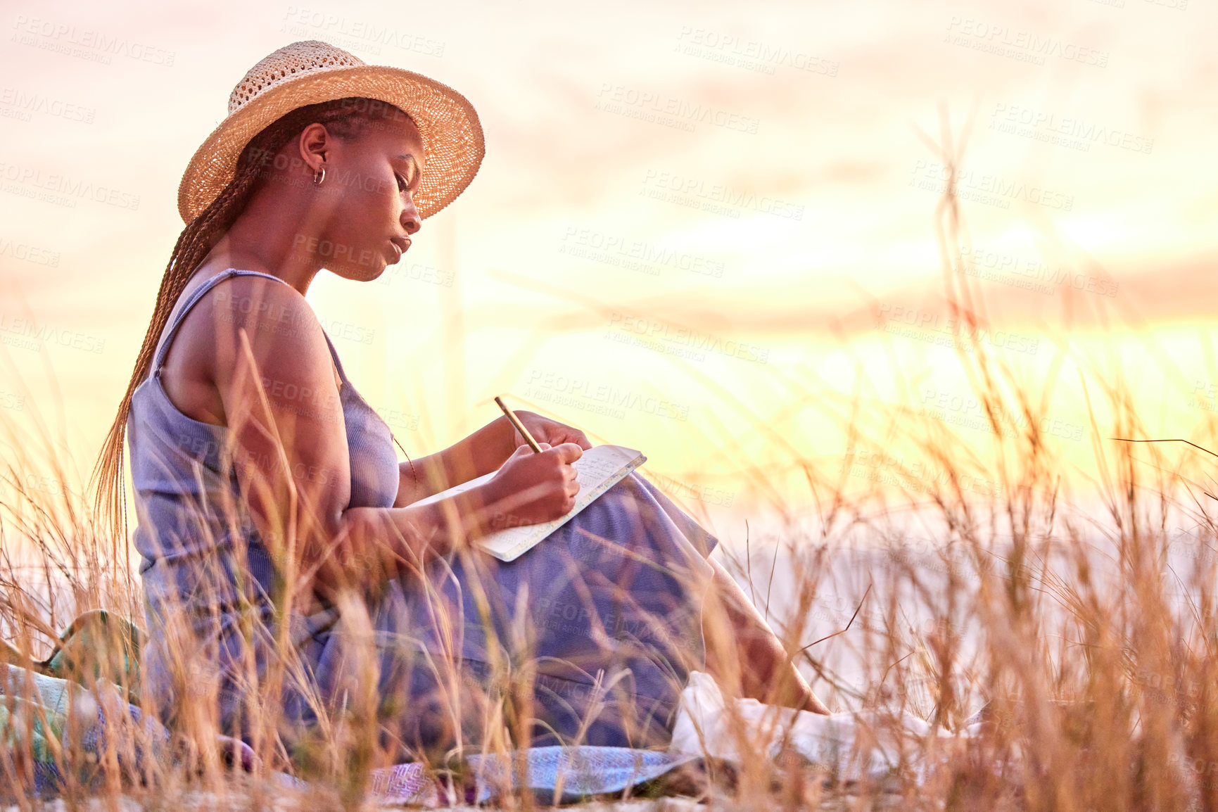 Buy stock photo Sunset, diary and black woman journaling in nature to relax on vacation, adventure or holiday. Mental health, ideas and African female person writing notes, feelings or emotions on weekend trip.
