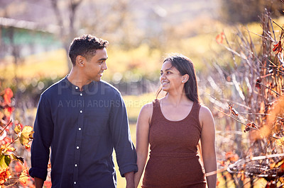 Buy stock photo Shot of a young couple having a date on a wine farm