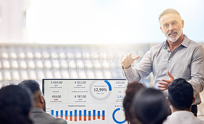 Buy stock photo Cropped shot of a handsome mature businessman giving a presentation in the conference room