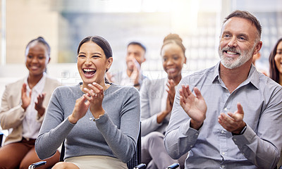 Buy stock photo Cropped shot of a group of businesspeople applauding while sitting in the office during a conference
