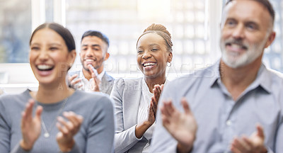 Buy stock photo Cropped shot of a group of businesspeople applauding while sitting in the office during a conference