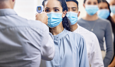 Buy stock photo Cropped shot of a group of businesspeople wearing masks lined up to be screened for covid 19